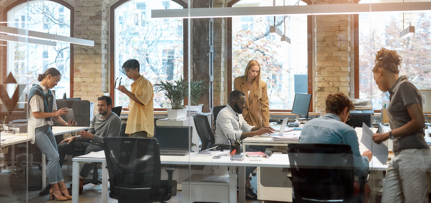 Coworkers collaborating on how to engage each other and other employees during hard times and economic hardships  