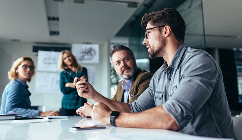 Data and documents being viewed by employees to see how to fill training gaps in the organization's mentoring program 