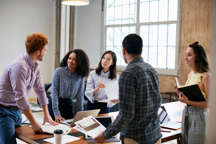 Employees returning and talking to their previous coworkers and discussing how their journey ha made them different and more productive 