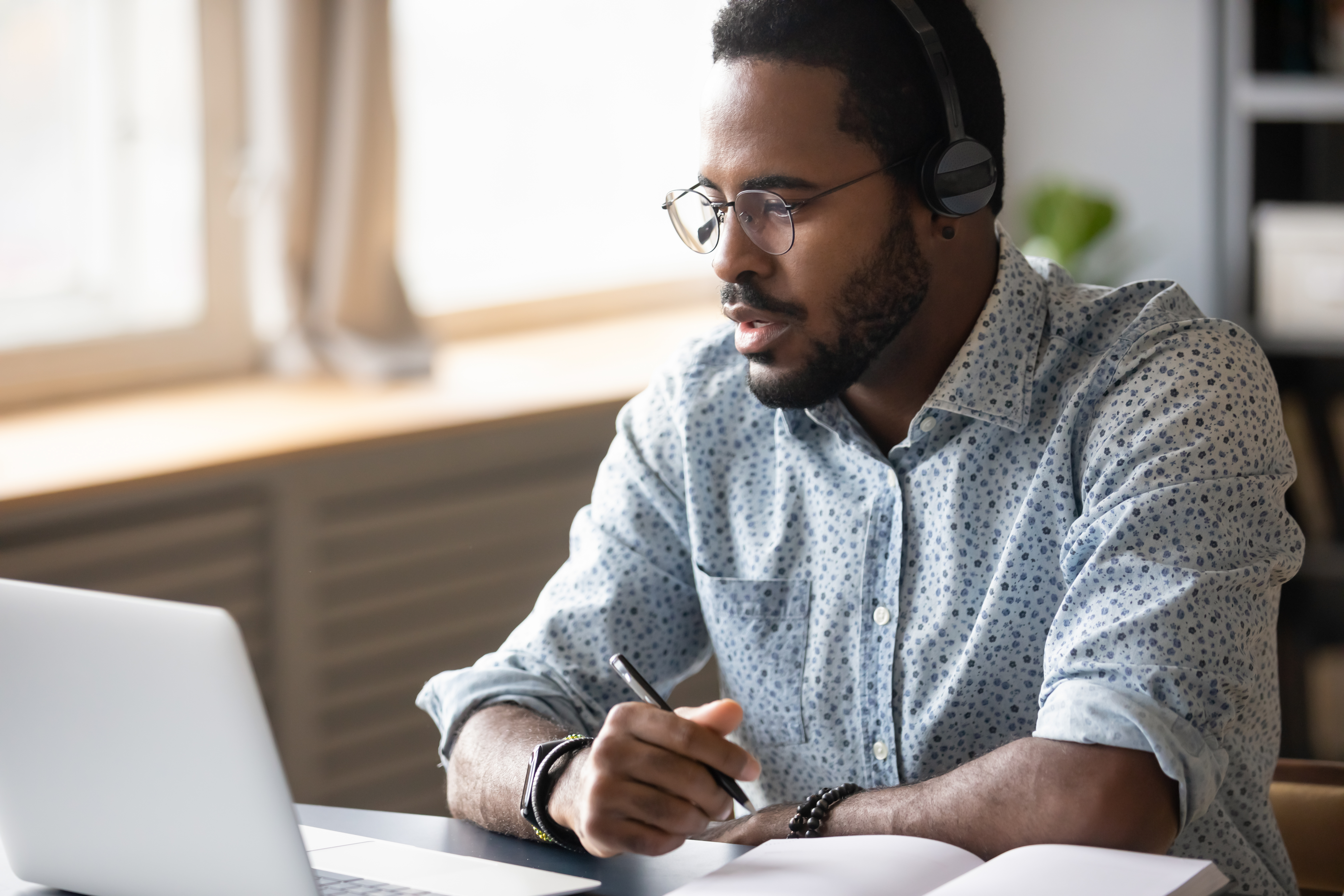 a new hire working from home engaging in a virtual onboarding mentoring program