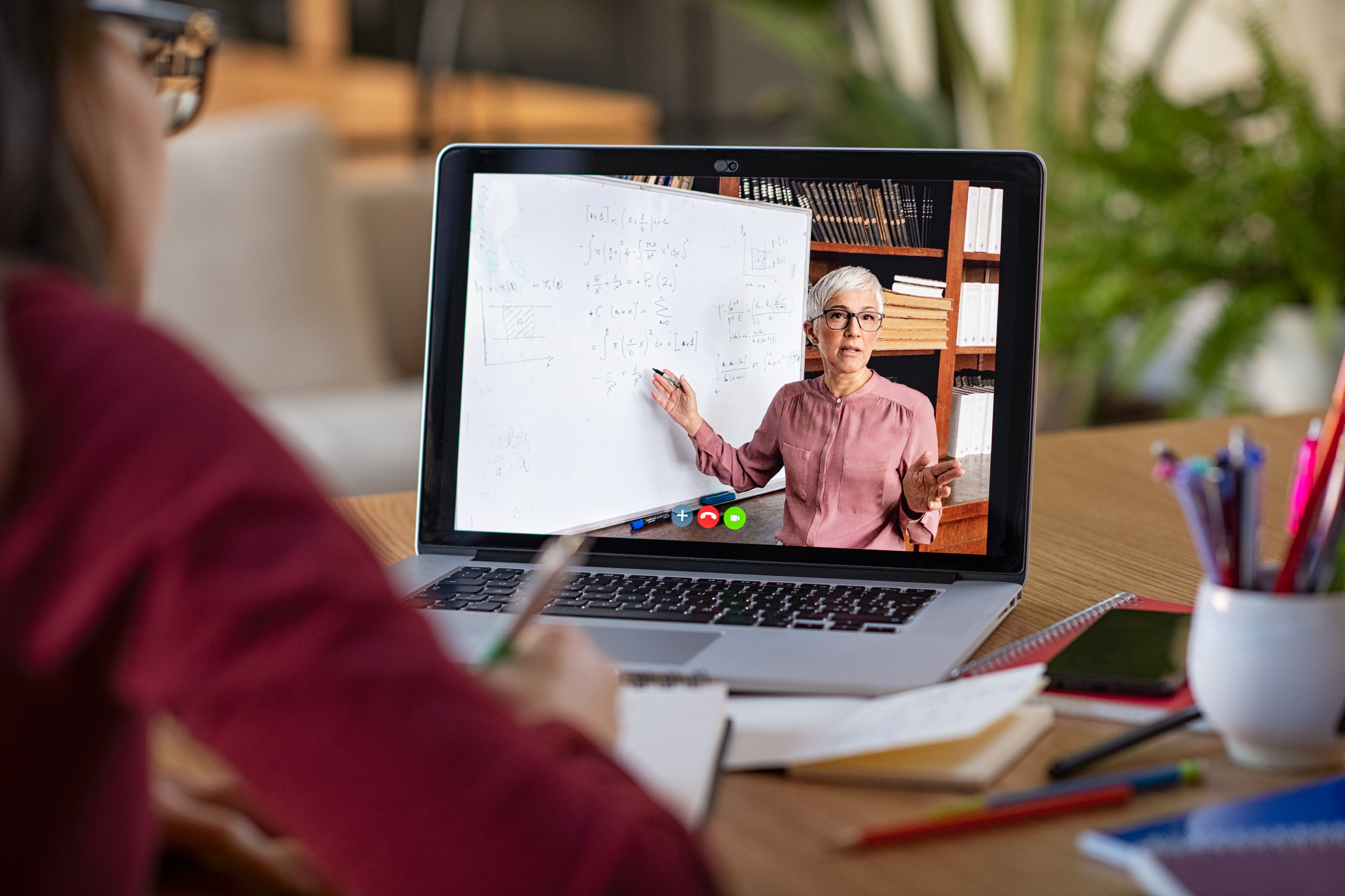 an employe sitting at a desk participating in an eLearning course on their laptop